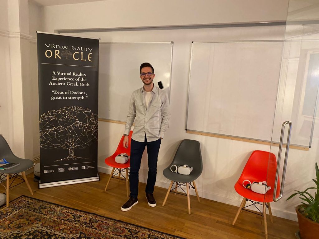 A banner of the Virtual Reality Oracle Project and VR headsets on chairs