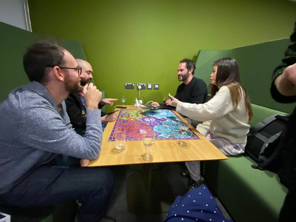 People playing an augmented reality board game